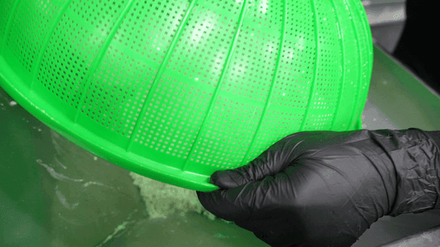White rice poured from green tray