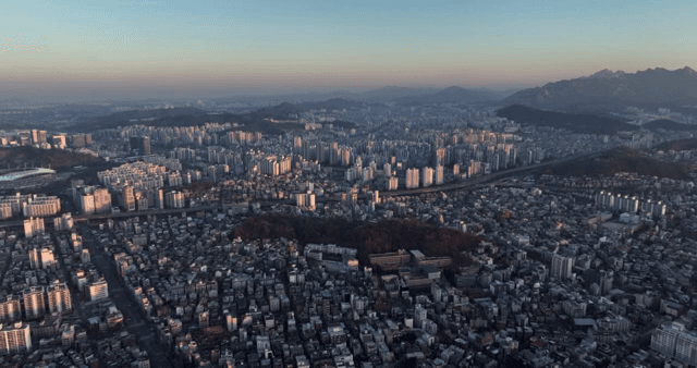 Expansive cityscape with distant mountains