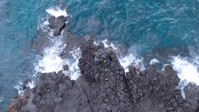 People fishing on rocky seaside cliffs