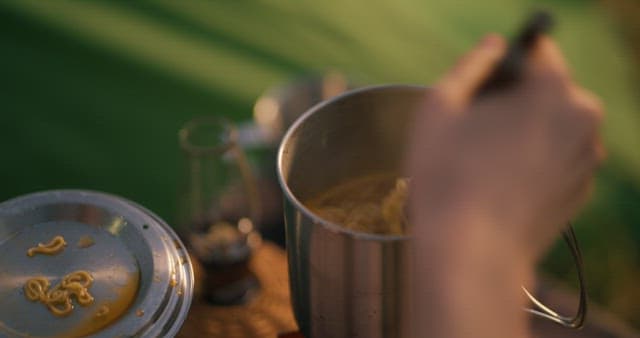 Eating Ramen from the Kettle Lid