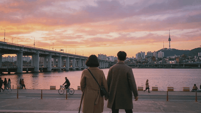 City riverside park with dating couples