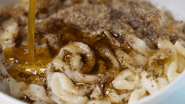 Chicken kalguksu topped with perilla oil and perilla seed powder