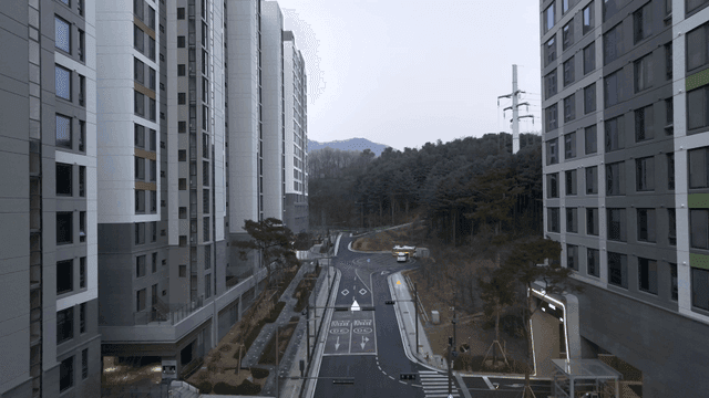 Quiet city street with tall apartments