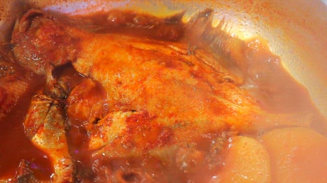 Steamed fish containing various fish simmering in a pot