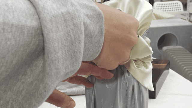 Wrapping a bottle with traditional fabric