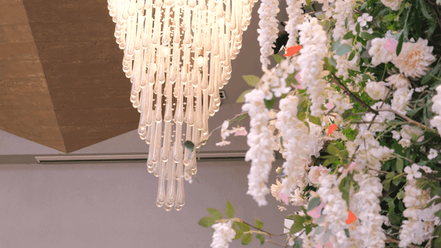 Elegant chandelier and floral decor indoors