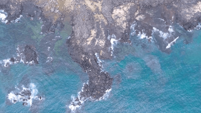Rocky coastline with turquoise waves