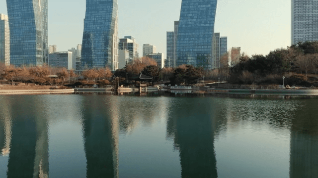 Modern cityscape with a serene lake