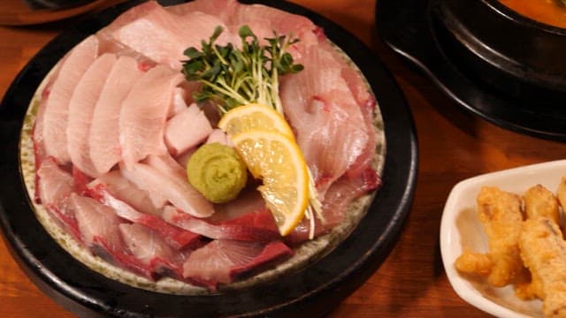 Korean dishes with sashimi and stew