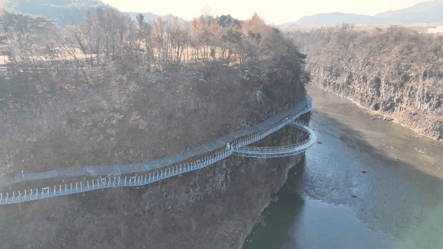 Scenic walkway along a river cliff