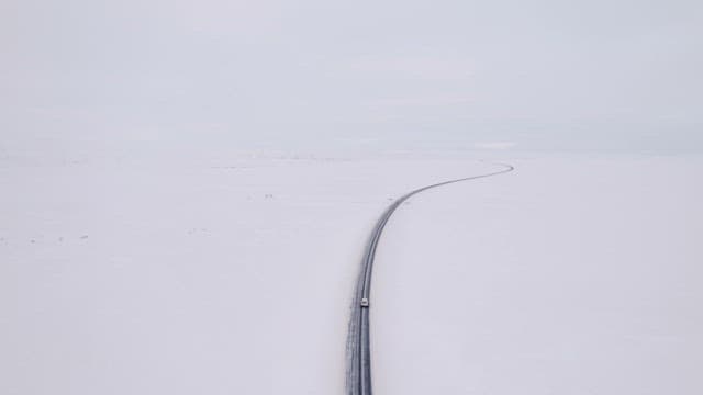 Car driving on a snowy road