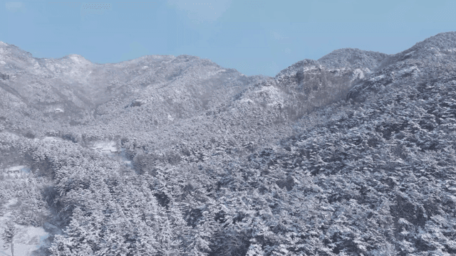 Snow-covered mountains under a clear sky