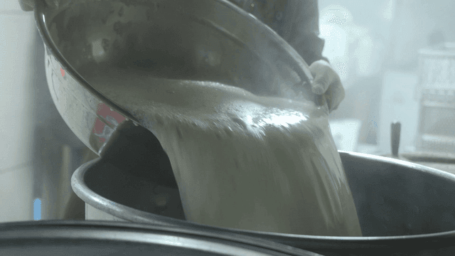Bean water poured into large pot