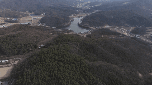 Aerial view of a mountainous landscape with a river