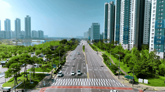 Wide city road with tall apartments