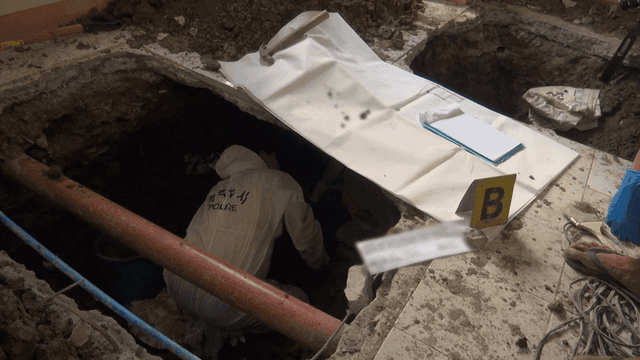 Police investigating a site indoors