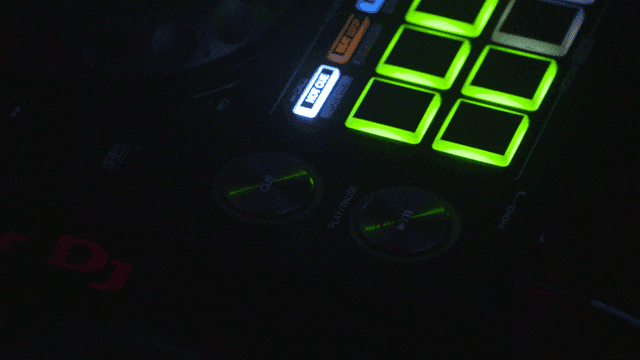 DJ equipment illuminated with colorful lights