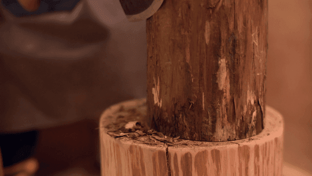 Axe chopping wood indoors
