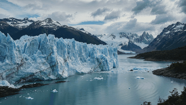 Massive glacier spread out along with surrounding mountains.