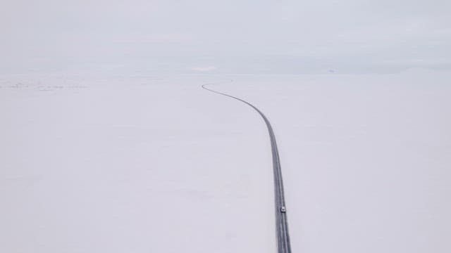 Car driving on a snowy road