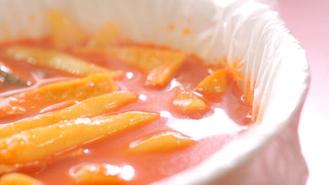 Spicy tteokbokki in a white bowl