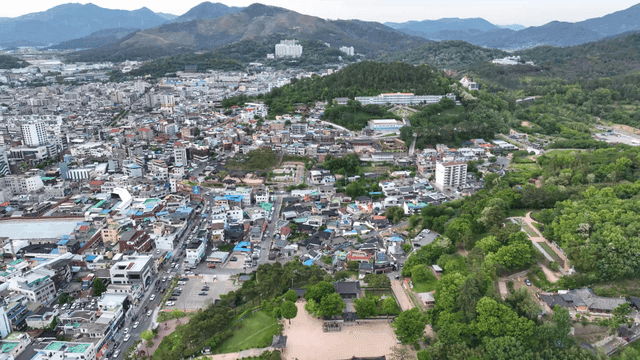 Sprawling city with surrounding mountains
