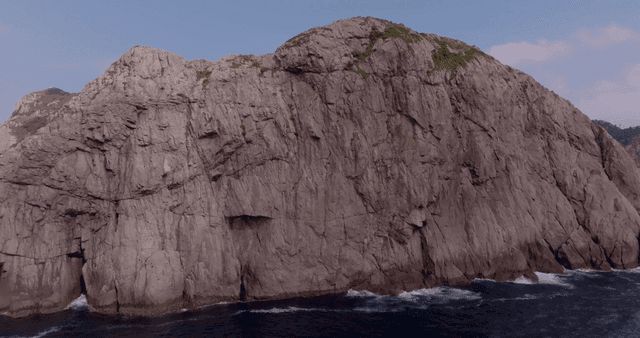 Rocky coastline with a distant boat