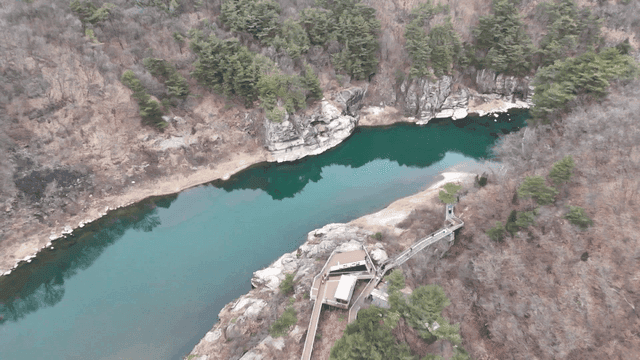 Serene river surrounded by rocky cliffs