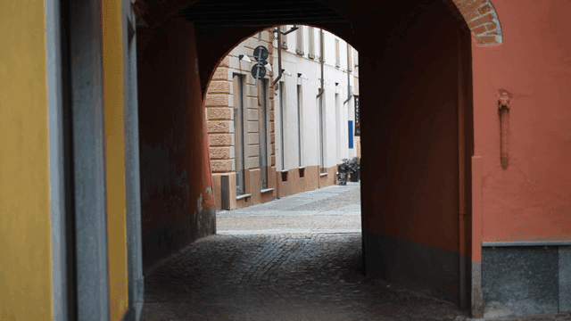 Narrow alleyway leading to a street
