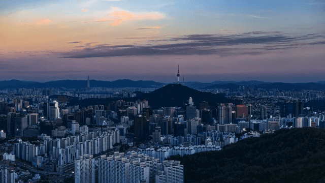 Sprawling cityscape with distant mountains