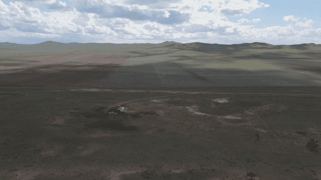 Vast open plains under a cloudy sky