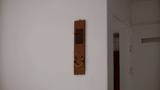 Wooden clock on a white wall