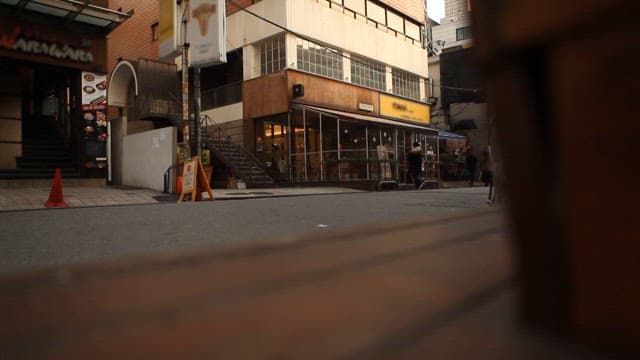 City street scene with a pedestrian passing by