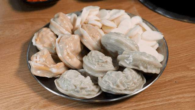 Kimchi dumplings, meat dumplings, and rice cakes