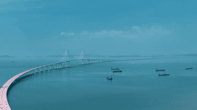 Long bridge stretching over sea.