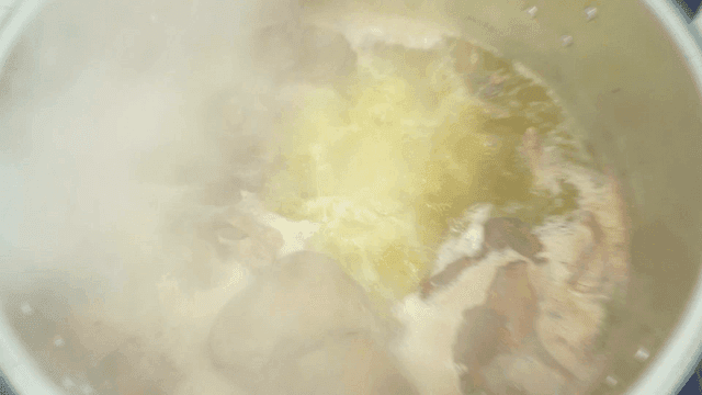 Large pot of boiling broth