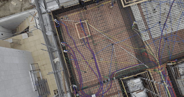 Construction site with scaffolding and cables