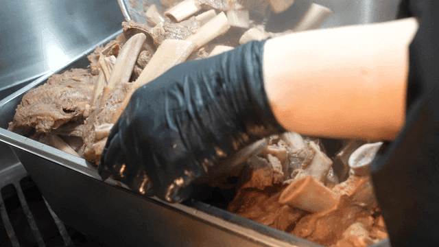 Boiled beef ribs being prepared in a kitchen