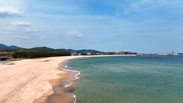 Serene beach with distant mountains