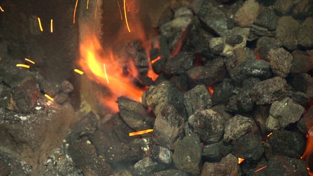 Burning coals with bright flames