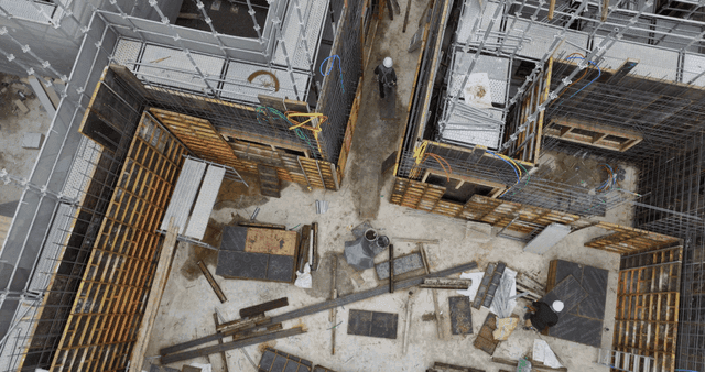 Construction site with scaffolding and worker