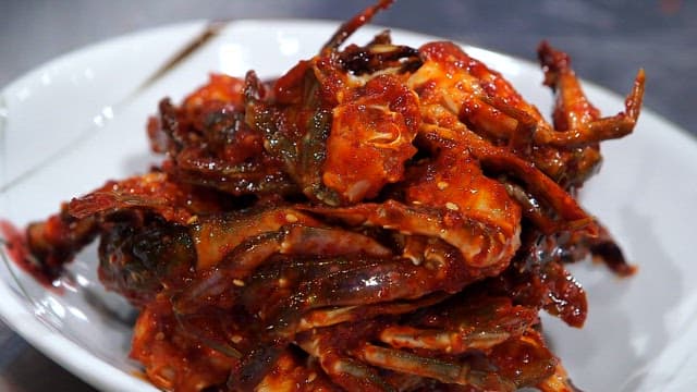 Spicy marinated crabs on a plate