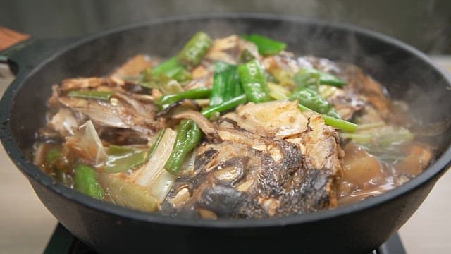 Appetizing braised fish with fresh vegetables