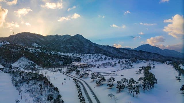 Snowy Mountainous Landscape at Dusk