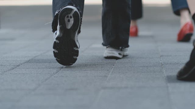 People Walking Down a City Street