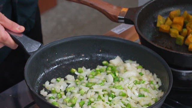 Cooking Fried Rice with Onions and Asparagus in a Pan