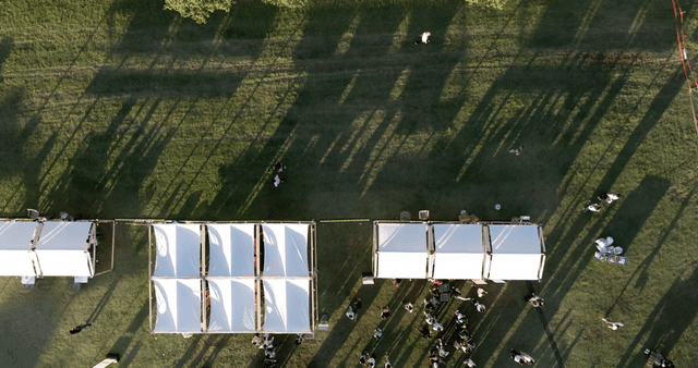 Outdoor event with tents and people