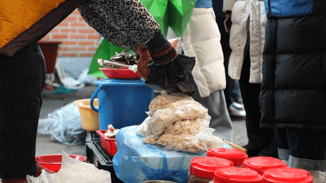 Outdoor market with various Korean foods