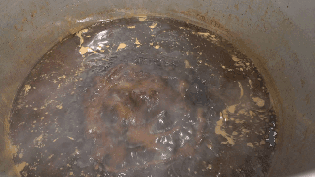 Soy sauce broth boiling on stove