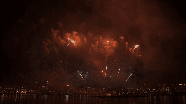 Fireworks display over a city skyline